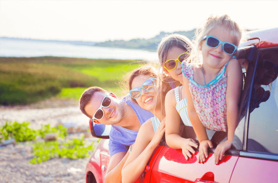 family in vehicle with sunglasses