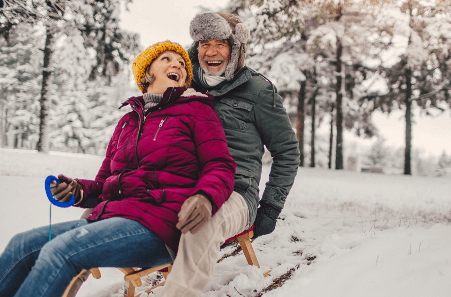 Couple riding sled