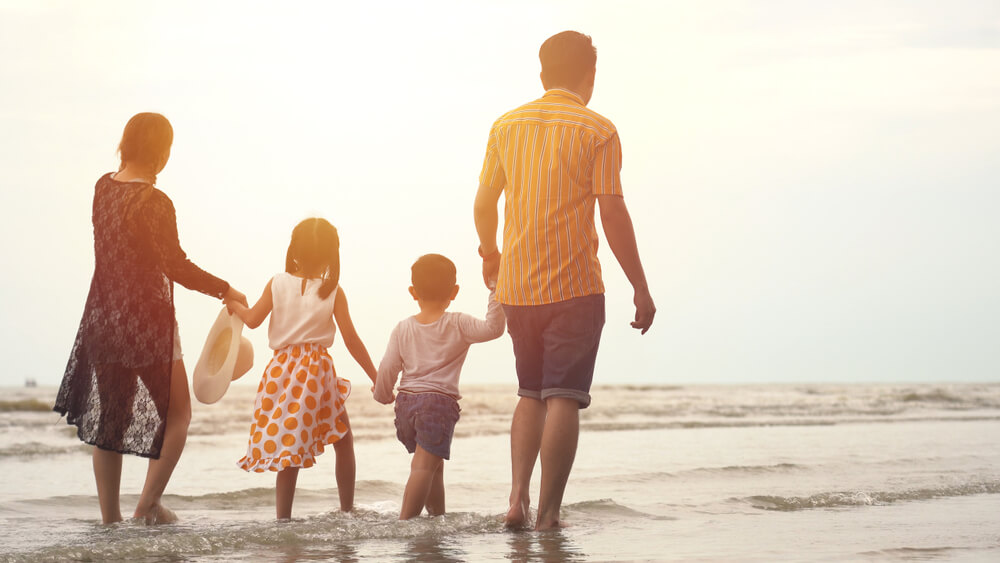 Family walking on beach